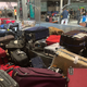 A photo of suitcases piled up on a baggage carousel at Heathrow Airport.